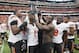 HOUSTON, TX - AUGUST 31: Ra'Shaad Samples #1 of the Oklahoma State Cowboys along with his teammates hold up the Advocare at Reliant Stadium on August 31, 2013 in Houston, Texas. (Photo by Bob Levey/Getty Images)