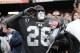 Aug 9, 2013; Oakland, CA, USA; Fan in the Black Hole salutes during National Anthem in an preseason game between the Oakland Raiders and the Dallas Cowboys at O.co Coliseum. Mandatory Credit: Bob Stanton-USA TODAY Sports