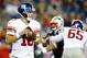FOXBORO, MA - AUGUST 29: Eli Manning #10 of the New York Giants drops back to pass against the New England Patriots in the first quarter during the preseason game at Gillette Stadium on August 29, 2013 in Foxboro, Massachusetts. (Photo by Jared Wickerham/Getty Images)