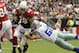 Aug 17, 2013; Phoenix, AZ, USA; Arizona Cardinals running back Rashard Mendenhall (28) runs the ball as he is pursued by Dallas Cowboys linebacker Sean Lee (50) during the first quarter at University of Phoenix Stadium. Mandatory Credit: Casey Sapio-USA TODAY Sports