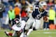 FOXBORO, MA - AUGUST 29: Tim Tebow #5 of the New England Patriots evades a tackle and runs with the ball past Adewale Ojomo #71 of the New York Giants during the preseason game at Gillette Stadium on August 29, 2013 in Foxboro, Massachusetts. (Photo by Jared Wickerham/Getty Images)