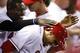 CINCINNATI, OH - SEPTEMBER 3: Billy Hamilton #6 of the Cincinnati Reds is mobbed by Brandon Phillips #4 after scoring a run in the seventh inning of the game against the St. Louis Cardinals at Great American Ball Park on September 3, 2013 in Cincinnati, Ohio. The Reds won 1-0. (Photo by Joe Robbins/Getty Images)
