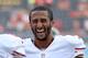 SAN DIEGO, CA - AUGUST 29: Colin Kaepernick #7 of the San Francisco 49ers laughs as he returns to the locker room after a warm up before a preseason game against the San Diego Chargers at Qualcomm Stadium on August 29, 2013 in San Diego, California. (Photo by Harry How/Getty Images)