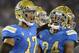 PASADENA, CA - AUGUST 31: Brett Hundley #17 and Paul Perkins #24 of the UCLA Bruins celebrate a touchdown and a 43-20 lead over the Nevada Wolf Pack during the fourth quarter at Rose Bowl on August 31, 2013 in Pasadena, California. (Photo by Harry How/Getty Images)