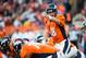 DENVER, CO - DECEMBER 2: Quarterback Peyton Manning #18 of the Denver Broncos adjusts the play at the line of scrimmage during a game against the Tampa Bay Buccaneers at Sports Authority Field Field at Mile High on December 2, 2012 in Denver, Colorado. (Photo by Dustin Bradford/Getty Images)