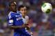 BANGKOK, THAILAND - JULY 17: Victor Moses of Chelsea is checked by Nattaporn of Singha Thailand All-Star XI during the international friendly match between Chelsea FC and the Singha Thailand All-Star XI at the Rajamangala Stadium in Bangkok, Thailand on July 17, 2013 in Bangkok, Thailand. (Photo by Stanley Chou/Getty Images)