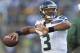 Aug 23, 2013; Green Bay, WI, USA; Seattle Seahawks quarterback Russell Wilson (3) warms up prior to the game against the Green Bay Packers at Lambeau Field. Mandatory Credit: Jeff Hanisch-USA TODAY Sports