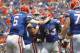 Aug 31, 2013; Gainesville, FL, USA; Florida Gators running back Mack Brown (33) is congratulated by quarterback Jeff Driskel (6) and teammates after he ran the ball in for a touchdown during the first half against the Toledo Rockets at Ben Hill Griffin Stadium. Mandatory Credit: Kim Klement-USA TODAY Sports
