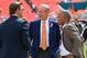 Oct.14, 2012; Miami, FL, USA; St. Louis Rams general manager Les Snead (left) talks with Miami Dolphins owner Stephen Ross (center) as Dolphins senior director of guest, member & fan services, Reginald Sperling (right) prior to a game at Sun Life Stadium. Mandatory Credit: Steve Mitchell-USA TODAY Sports
