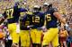 ANN ARBOR, MI - AUGUST 31: Devin Gardner #12 of the Michigan Wolverines celebrates a first quarter touchdown with Michael Schofield #75, Fitzgerald Toussaint #28 and Devin Funchess #87 while playing the Central Michigan Chippewas at Michigan Stadium on August 31, 2013 in Ann Arbor, Michigan. (Photo by Gregory Shamus/Getty Images)