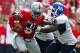 COLUMBUS, OH - AUGUST 31: Braxton Miller #5 of the Ohio State Buckeyes is wrapped up by Tedroy Lynch #92 of the Buffalo Bulls during the fourth quarter on August 31, 2013 at Ohio Stadium in Columbus, Ohio. Ohio State defeated Buffalo 40-20. (Photo by Kirk Irwin/Getty Images)
