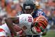 Jan 27, 2013, Honolulu, HI, USA; Chicago Bears cornerback Tim Jennings (26) tackles Cincinnati Bengals receiver A.J. Green (16) during the 2013 Pro Bowl at Aloha Stadium. The NFC defeated the AFC 62-35. Mandatory Credit: Kirby Lee-USA TODAY Sports