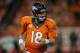 DENVER, CO - SEPTEMBER 5: Quarterback Peyton Manning #18 of the Denver Broncos walks off after going out on downs against the Baltimore Ravens during the game at Sports Authority Field at Mile High on September 5, 2013 in Denver Colorado. (Photo by Dustin Bradford/Getty Images)
