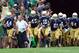 Aug 31, 2013; South Bend, IN, USA; Notre Dame coach Brian Kelly leads the team onto the field before the game against the Temple Owls at Notre Dame Stadium. Mandatory Credit: Brian Spurlock-USA TODAY Sports