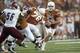 AUSTIN, TX - AUGUST 31: David Ash #14 of the Texas Longhorns scrambles against the New Mexico State Aggies on August 31, 2013 at Darrell K Royal-Texas Memorial Stadium in Austin, Texas. (Photo by Cooper Neill/Getty Images)
