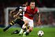 LONDON, ENGLAND - AUGUST 27: Jack Wilshere (R) of Arsenal holds off the challenge of Selcuk Sahin of Fenerbahce during the UEFA Champions League Play Off Second leg match between Arsenal FC and Fenerbahce SK at Emirates Stadium on August 27, 2013 in London, England. (Photo by Michael Regan/Getty Images)