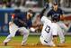 NEW YORK, NY - SEPTEMBER 6: Second baseman Dustin Pedroia #15 of the Boston Red Sox tags out Alex Rodriguez #13 of the New York Yankees as he attempted to steal second base during the first inning in an MLB baseball game at Yankee Stadium on September 6, 2013 in the Bronx borough of New York City. (Photo by Rich Schultz/Getty Images)