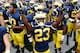 ANN ARBOR, MI - AUGUST 31: Dennis Norfleet #23 of the Michigan Wolverines celebrates a 59-9 win over the Central Michigan Chippewas with teammates at Michigan Stadium on August 31, 2013 in Ann Arbor, Michigan. (Photo by Gregory Shamus/Getty Images)