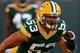 GREEN BAY, WI - AUGUST 09: Nick Perry #53 of the Green Bay Packers participates in warm-ups before a game against the Arizona Cardinals at Lambeau Field on August 9, 2013 in Green Bay, Wisconsin. The Cardinals defeated the Packers 17-0. (Photo by Jonathan Daniel/Getty Images)