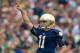 Aug 31, 2013; South Bend, IN, USA; Notre Dame Fighting Irish quarterback Tommy Rees (11) celebrates after throwing a touchdown pass in the first quarter against the Temple Owls at Notre Dame Stadium. Mandatory Credit: Matt Cashore-USA TODAY Sports