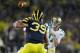 ANN ARBOR, MI - SEPTEMBER 10: Tommy Rees #11 of the Notre Dame Fighting Irish throws a first quarter pass behind Will Heininger #39 of the Michigan Wolverines at Michigan Stadium on September 10, 2010 in Ann Arbor, Michigan. (Photo by Gregory Shamus/Getty Images)