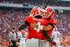 Sep 7, 2013; Athens, GA, USA; Georgia Bulldogs running back Keith Marshall (4) celebrates a touchdown with quarterback Aaron Murray (11) and offensive tackle Kolton Houston (75) in the first half against the South Carolina Gamecocks at Sanford Stadium. Mandatory Credit: Daniel Shirey-USA TODAY Sports