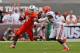 MIAMI GARDENS, FL - SEPTEMBER 07: Duke Johnson #8 of the Miami Hurricanes rushes past Brian Poole #24 of the Florida Gatorsduring a game at Sun Life Stadium on September 7, 2013 in Miami Gardens, Florida. (Photo by Mike Ehrmann/Getty Images)