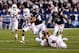 Sep 7, 2013; Provo, UT, USA; Brigham Young Cougars quarterback Taysom Hill (4) breaks tackles from Texas Longhorns safety Josh Turner (5) and Texas Longhorns cornerback Sheroid Evans (29) scores a touchdown at Lavell Edwards Stadium. Mandatory Credit: Chris Nicoll-USA TODAY Sports