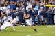 Sep 7, 2013; Provo, UT, USA; Brigham Young Cougars quarterback Taysom Hill (4) slips through the arms of Texas Longhorns defensive end Reggie Wilson (92) during the second quarter at Lavell Edwards Stadium. Mandatory Credit: Chris Nicoll-USA TODAY Sports