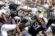Sep 7, 2013; University Park, PA, USA; Eastern Michigan Eagles running back Bronson Hill (30) leaps over Penn State Nittany Lions defensive tackle DaQuan Jones (91) during the third quarter at Beaver Stadium. Penn State defeated Eastern Michigan 45-7. Mandatory Credit: Matthew O'Haren-USA TODAY Sports
