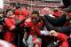 COLUMBUS, OH - NOVEMBER 24: Kenny Guiton #13 of the Ohio State Buckeyes is mobbed by fans on the field after Ohio State defeated the Michigan Wolverines 26-21at Ohio Stadium on November 24, 2012 in Columbus, Ohio. (Photo by Jamie Sabau/Getty Images)