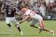 COLLEGE STATION, TX - SEPTEMBER 07: Johnny Manziel #2 of the Texas A&M Aggies avoids being tackled by Tanner Brock #35 of the Sam Houston State Bearkats in the second quarter at Kyle Field on September 7, 2013 in College Station, Texas. (Photo by Bob Levey/Getty Images)