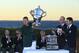 SOUTHAMPTON, NY - SEPTEMBER 08: Jim Holtgrieve, the victorious United States team captain (L) holds the Walker Cup at the trophy presentation as R&A Captain Pierre Bechmann and USGA President Glen D. Nager look on after Day Two of the 2013 Walker Cup at National Golf Links of America on September 8, 2013 in Southampton, New York. (Photo by Michael Cohen/Getty Images)