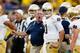 ANN ARBOR, MI - SEPTEMBER 07: Head coach Brian Kelly of the Notre Dame Fighting Irish
talks to quarterback Tommy Rees #11 before the game against the Michigan Wolverines at Michigan Stadium on September 7, 2013 in Ann Arbor, Michigan. (Photo by Gregory Shamus/Getty Images)