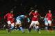 MANCHESTER, ENGLAND - APRIL 08: Sergio Aguero of Manchester City scores his team's second goal to make the score 1-2 during the Barclays Premier League match between Manchester United and Manchester City at Old Trafford on April 8, 2013 in Manchester, England. (Photo by Alex Livesey/Getty Images)