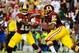 Sep 9, 2013; Landover, MD, USA; Washington Redskins quarterback Robert Griffin III (10) prepares to hand off to Washington Redskins running back Alfred Morris (46) during the first half against the Philadelphia Eagles at FedEX Field. Mandatory Credit: Brad Mills-USA TODAY Sports