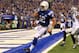 Sep 8, 2013; Indianapolis, IN, USA; Indianapolis Colts quarterback Andrew Luck (12) scores a touchdown against the Oakland Raiders at Lucas Oil Stadium. The Colts won 21-17. Mandatory Credit: Pat Lovell-USA TODAY Sports