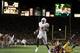 PASADENA, CA - JANUARY 04: Vince Young #10 of the Texas Longhorns runs past Frostee Rucker #90 of the USC Trojans to score a touchdown and put the Longhorns up by one in the final moments of the BCS National Championship Rose Bowl Game at the Rose Bowl on January 4, 2006 in Pasadena, California. Texas defeated USC 41-38. (Photo by Harry How/Getty Images)