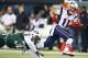 EAST RUTHERFORD, NJ - NOVEMBER 22: Wide receiver Julian Edelman #11 of the New England Patriots makes a catch for a touchdown as LaRon Landry #30 defends during the second quarter of a game at MetLife Stadium on November 22, 2012 in East Rutherford, New Jersey. (Photo by Rich Schultz /Getty Images)