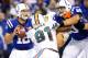 Nov 4, 2012; Indianapolis, IN, USA; Indianapolis Colts quarterback Andrew Luck (12) drops back to pass as tackle Bradley Sowell (60) blocks Miami Dolphins defensive end Cameron Wake (91) during the game at Lucas Oil Stadium. Mandatory Credit: Thomas J. Russo-USA TODAY Sports