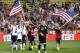 Sep 10, 2013; Columbus, OH, USA; Landon Donovan (right) and the United States soccer team celebrate a 2-0 win over Mexico at Columbus Crew Stadium. Mandatory Credit: David Richard-USA TODAY Sports