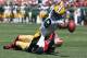 SAN FRANCISCO, CA - SEPTEMBER 08: Randall Cobb #18 of the Green Bay Packers stretches across the goal line for a touchdown while being pulled down by Carlos Rogers #22 of the San Francisco 49ers in the first quarter at Candlestick Park on September 8, 2013 in San Francisco, California. The 49ers defeated the Packers 34-28. (Photo by Jeff Gross/Getty Images)