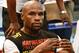 LAS VEGAS, NV - AUGUST 28: Boxer Floyd Mayweather Jr. does sit-ups as he works out at the Mayweather Boxing Club on August 28, 2013 in Las Vegas, Nevada. Mayweather will face Canelo Alvarez in a WBC/WBA 154-pound title fight on September 14 in Las Vegas. (Photo by Ethan Miller/Getty Images)