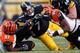 PITTSBURGH, PA - DECEMBER 23: Ben Roethlisberger #7 of the Pittsburgh Steelers is tackled during the fourth quarter by Geno Atkins #97 and Carlos Dunlap #96 of the Cincinnati Bengals at Heinz Field on December 23, 2012 in Pittsburgh, Pennsylvania. Cincinnati won the game 13-10. (Photo by Gregory Shamus/Getty Images)