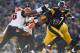 PITTSBURGH, PA - DECEMBER 23: Ben Roethlisberger #7 of the Pittsburgh Steelers tries to outrun the tackle of Carlos Dunlap #96 of the Cincinnati Bengals during the second quarter at Heinz Field on December 23, 2012 in Pittsburgh, Pennsylvania. (Photo by Gregory Shamus/Getty Images)