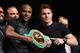 Floyd Mayweather and Saul Alvarez pose with the gold belt