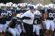 Sep 7, 2013; University Park, PA, USA; Penn State Nittany Lions head coach Bill O'Brien (center) leads his team onto the field prior to the game against the Eastern Michigan Eagles at Beaver Stadium. Mandatory Credit: Matthew O'Haren-USA TODAY Sports