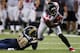 ST. LOUIS - NOVEMBER 21: Roddy White #84 of the Atlanta Falcons looks to slip past Darian Stewart #20 of the St. Louis Rams at the Edward Jones Dome on November 21, 2010 in St. Louis, Missouri. The Falcons beat the Rams 34-17. (Photo by Dilip Vishwanat/Getty Images)