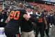 Jan 1, 2013; Dallas, TX, USA; Oklahoma State Cowboys head coach Mike Gundy celebrates a victory with defensive end Cooper Bassett (80) against the Purdue Boilermakers at the Cotton Bowl. The Cowboys beat the Boilermakers 58-14. Mandatory Credit: Matthew Emmons-USA TODAY Sports