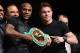 LAS VEGAS, NV - SEPTEMBER 11: Boxers Floyd Mayweather Jr. (L) and Canelo Alvarez hold a WBC super welterweight championship belt during the final news conference for their bout at the MGM Grand Hotel/Casino on September 11, 2013 in Las Vegas, Nevada. The fighters will meet in a WBC/WBA 154-pound title fight on September 14 in Las Vegas. (Photo by Ethan Miller/Getty Images)